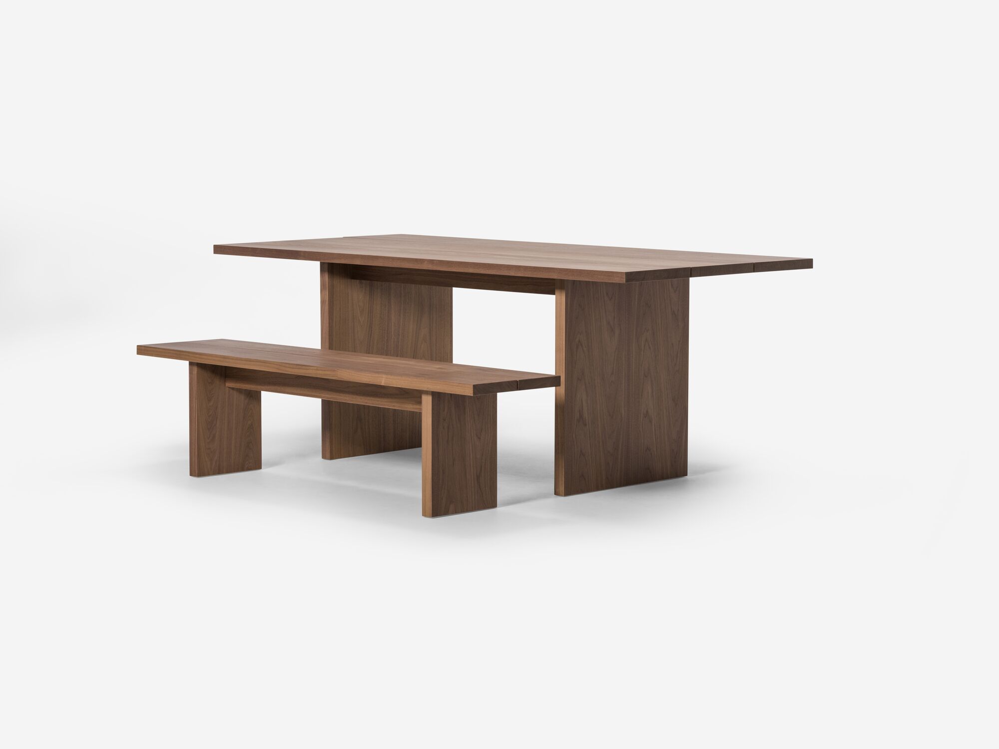 Walnut dining table and matching bench front view